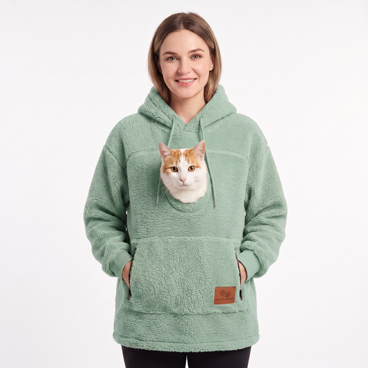 Pawket pet pouch hoodie in Mint with a ginger and white cat